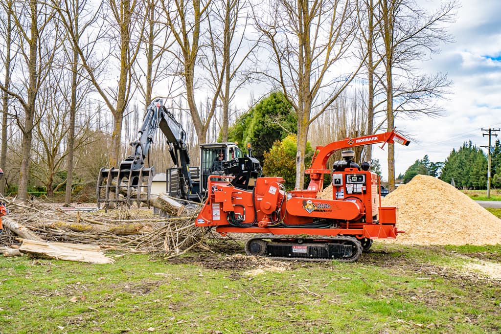 Our specialised team mulching logs